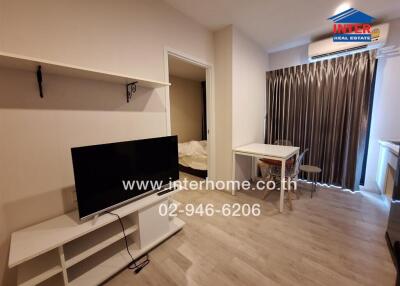 Modern living room with TV, shelves, dining table and air conditioning