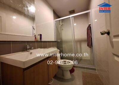 Modern bathroom with spacious shower and vanity