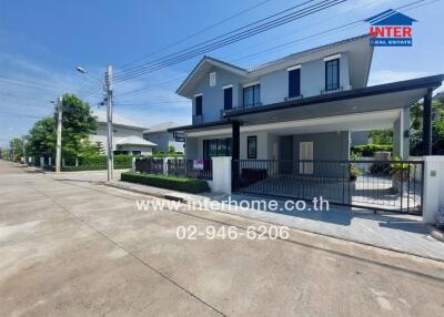 Two-story house with driveway and garage