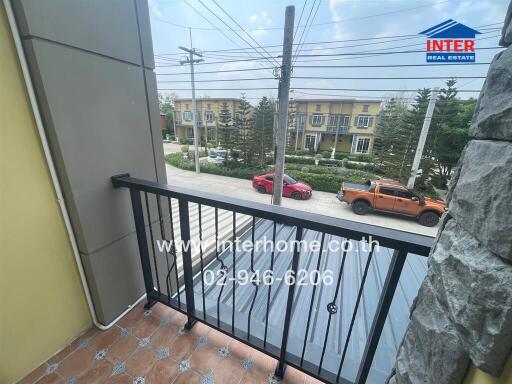 Balcony view with street and vehicles