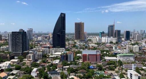 Panoramic view of a city with modern buildings and clear blue sky