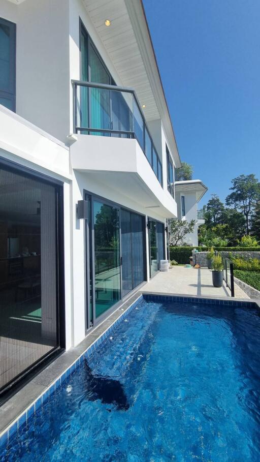 Modern house with a balcony and a swimming pool