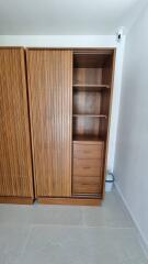 wooden wardrobe with sliding doors and shelves