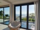 Living room with large windows overlooking pool and sea view