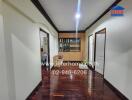 Main living space with hardwood floors and built-in cabinets