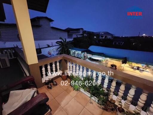 A balcony view from a residential property at dusk