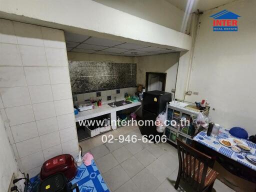 Photo of a kitchen area with dining table