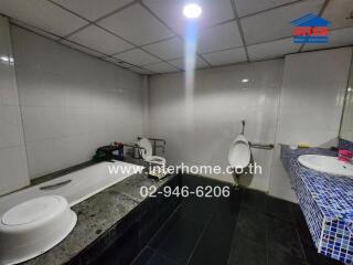 Bathroom with bathtub, urinal, and sink