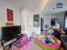 Living room with children's play area and television