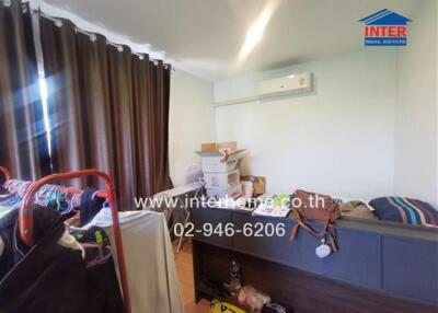 Bedroom with boxes and air conditioner