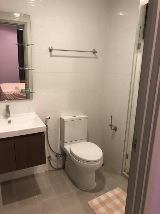 Modern bathroom with sink, toilet and shower