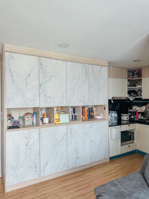 Modern kitchen with marble cabinets and wooden flooring