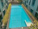 Outdoor swimming pool in an apartment complex