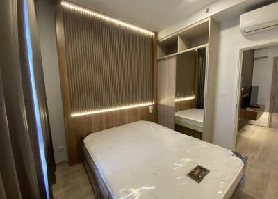 Modern bedroom with built-in wardrobe and cozy lighting