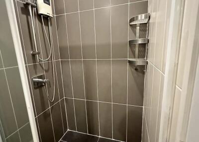 Modern bathroom with tiled shower area