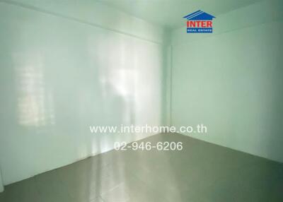 Empty room with white walls and tiled floor