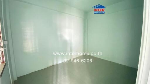 Empty room with white walls and tiled floor