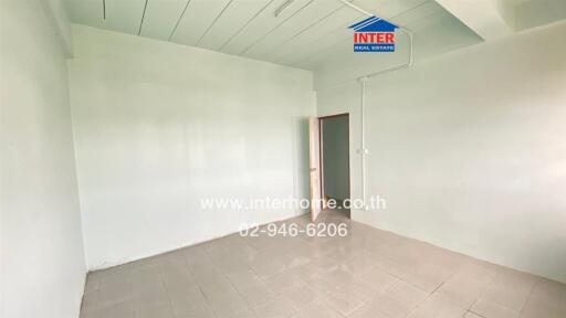 Empty room with tiled floor and open door
