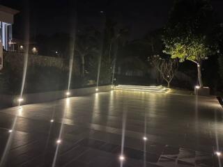 Night view of illuminated outdoor area with modern lighting