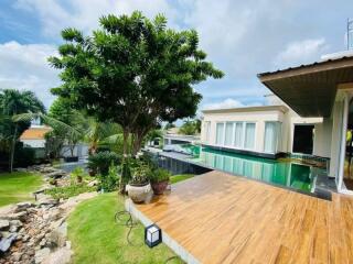 Luxurious villa patio with pool and lush garden