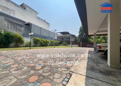 Spacious outdoor parking area in front of a building