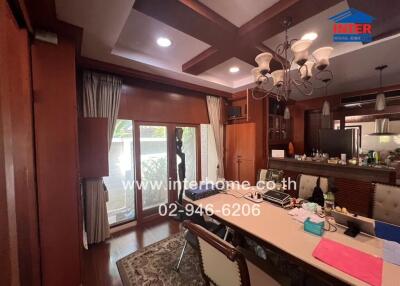 Elegant dining room with wooden accents and ample natural light