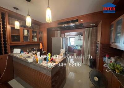 A well-equipped kitchen with wooden cabinets and a central island