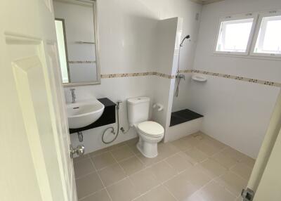 Modern bathroom with tiled floor and shower