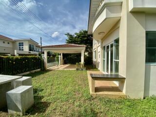 Outdoor space with lawn and seating area