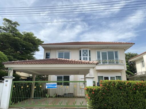 Two-story house with a gated driveway