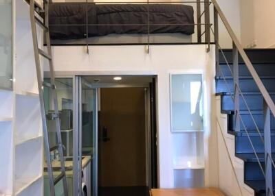 Loft-style studio apartment with mezzanine bed
