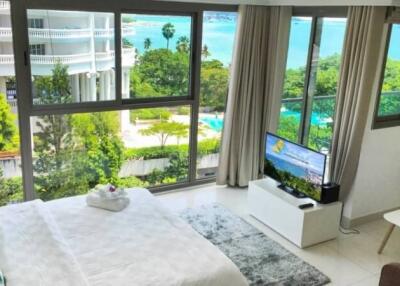 bedroom with large windows and scenic view
