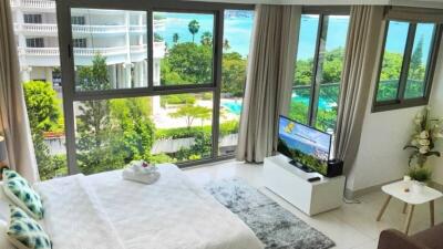bedroom with large windows and scenic view