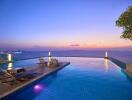 Infinity pool area with lounge chairs and stunning sunset view