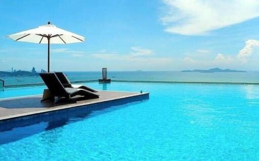 Infinity pool with lounge chairs and ocean view