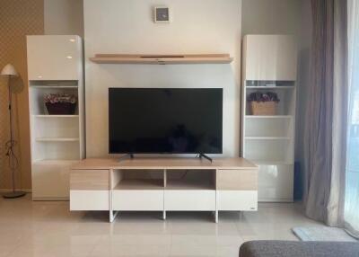 Modern living room with TV and shelving units