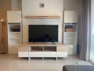 Modern living room with TV and shelving units