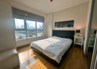 Sunlit bedroom with city view