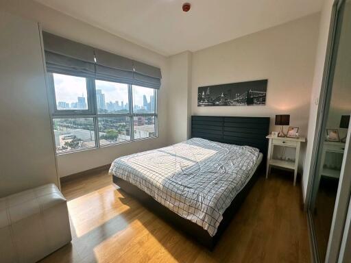 Sunlit bedroom with city view