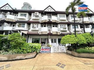 Front view of a residential building with balconies