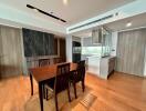 Modern dining area adjacent to a sleek kitchen