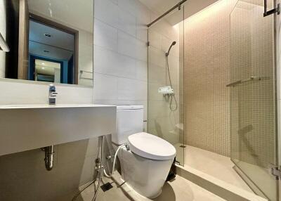 Modern bathroom with a white sink and glass shower