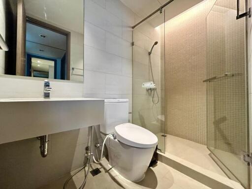 Modern bathroom with a white sink and glass shower