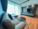 Modern living room with leather sofa and wall-mounted TV