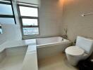 Modern bathroom with bathtub and toilet