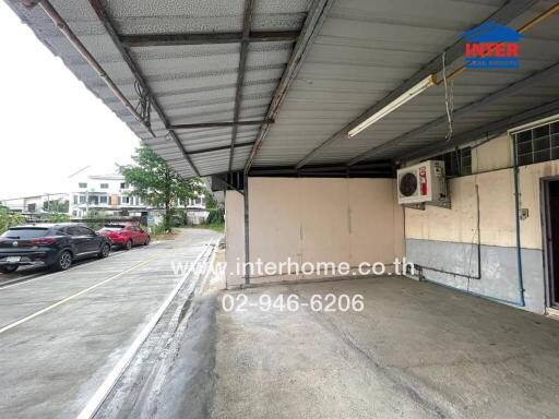 Covered garage with driveway