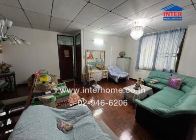 Spacious living room with various seating areas and decorations