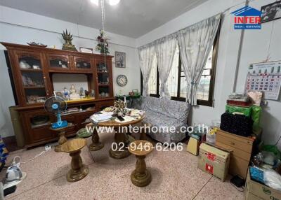 Living room with wooden furniture and decorative items