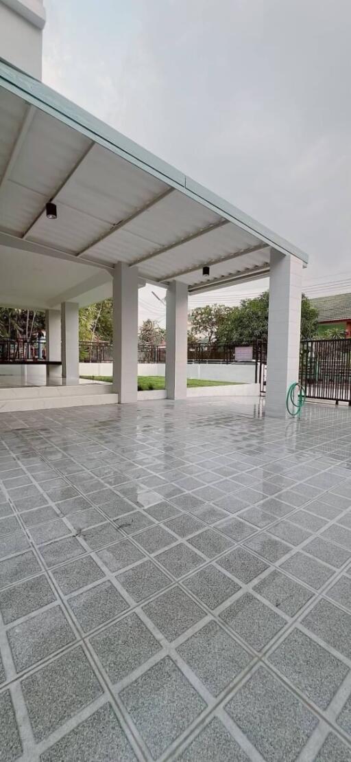 Covered outdoor area with tiled flooring