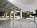 Covered outdoor area with tiled flooring